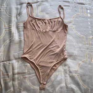 Nude light brown sleeveless bodysuit